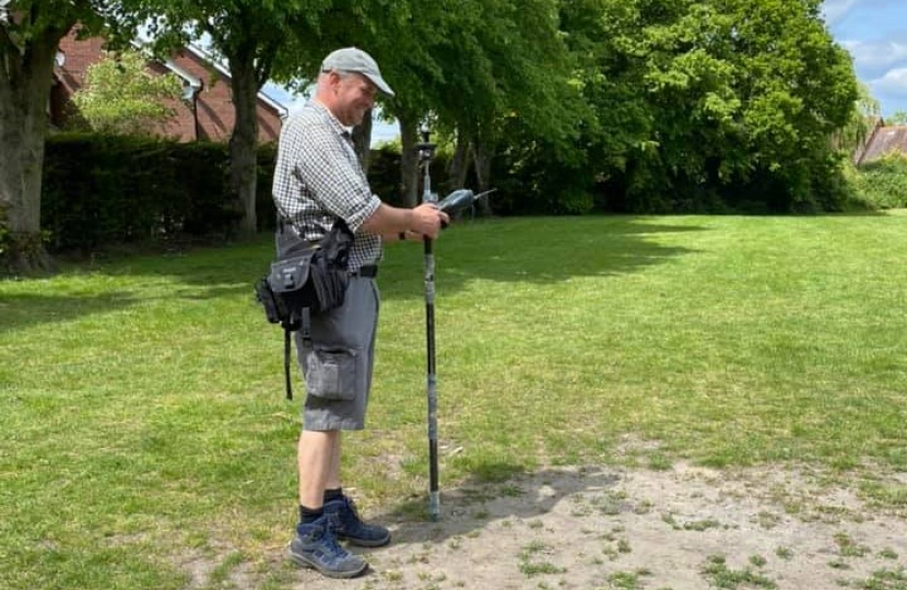 Pictured, James carrying out a survey at the recreation ground