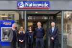 Pictured, Michael Gove with members of Nationwide Building Society's Camberley branch